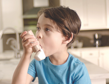 Step 2 image of child using QVAR RediHaler®, an inhaler for kids 4 yrs. and older
